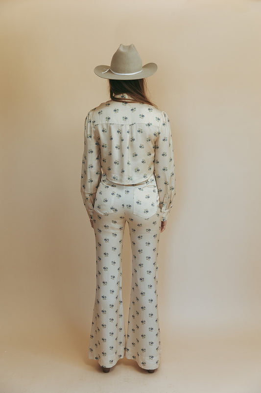 Bridget bell-bottom pants in Kindred Floral, studio back view showing the back pockets