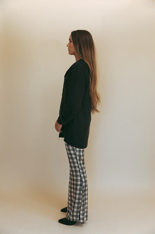 Bobbi blouse in Washed Black, studio side view showing the relaxed longline fit
