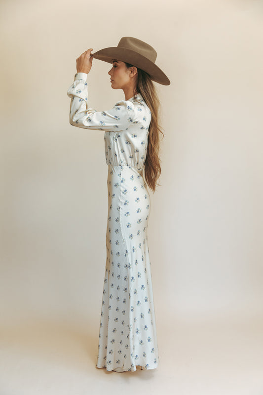 Dahlia maxi dress in Kindred Floral, studio side view tipping a cowboy hat