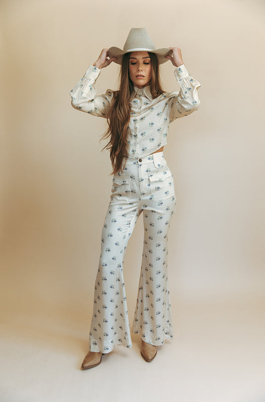 Bridget bell-bottom pants in Kindred Floral, studio front view with matching cropped blouse