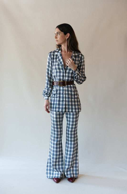 Bridget bell-bottom pants in Retro Plaid, studio front view with matching shirt and brown belt