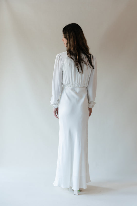 Dahlia maxi dress in Cloud, studio back view showing the puff sleeves and long skirt
