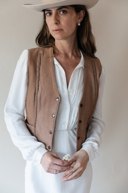 Dahlia maxi dress in Cloud, close-up layered under a tan leather vest