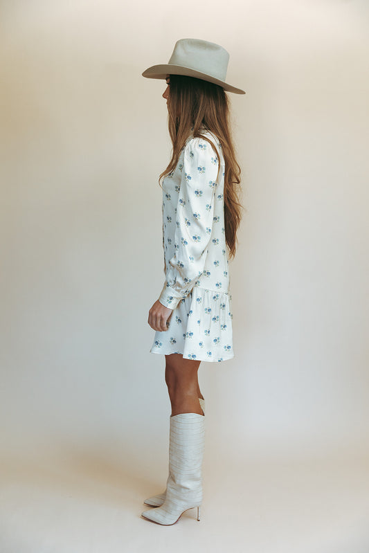 Sienna mini dress in Kindred Floral, studio side view with a gray cowboy hat