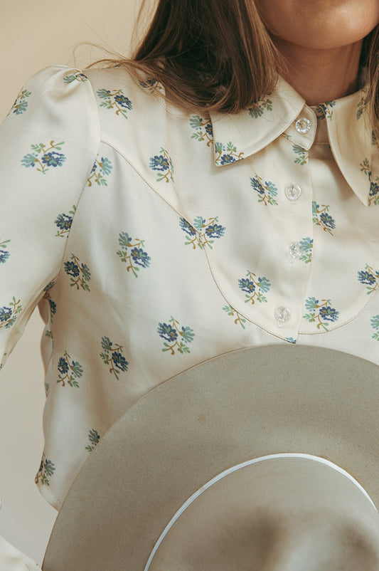 Marlowe cropped blouse in Kindred Floral, close-up of the curved yoke and clear buttons