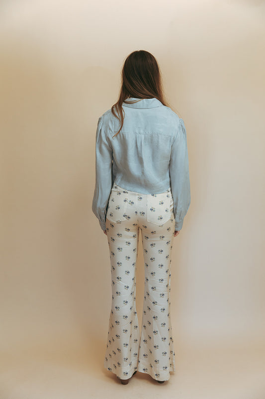 Marlowe cropped blouse in Hazy Blue, studio back view showing the back yoke