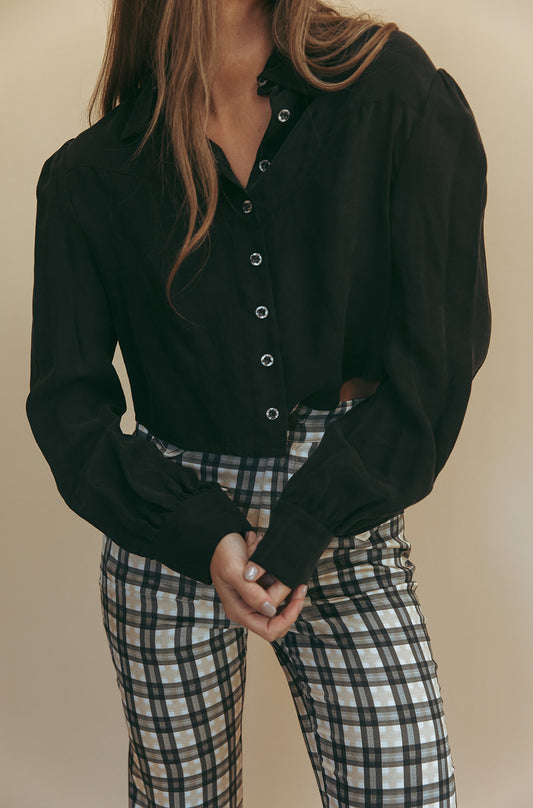 Marlowe cropped blouse in Washed Black, close-up of the metal buttons and cropped hem