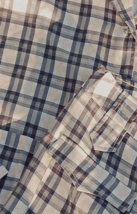 Bridget bell-bottom pants in Retro Plaid, close-up of the blue and cream plaid with a flap pocket